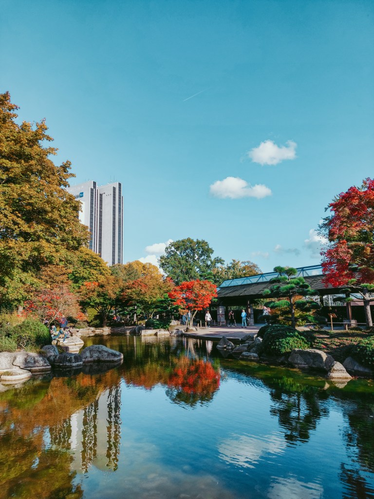 Autumn foliage reflected in the pond of the Japanese Garden at Planten un Blomen in Hamburg.