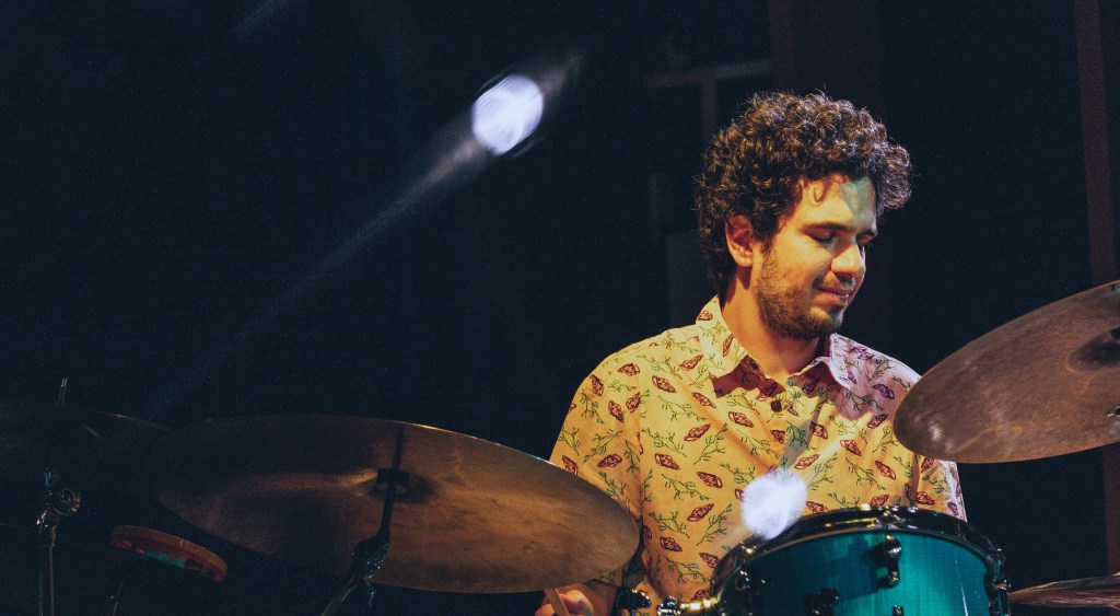 Amir Bresler performing on drums with the Gilad Hekselman Trio at JazzHall Hamburg in 2022